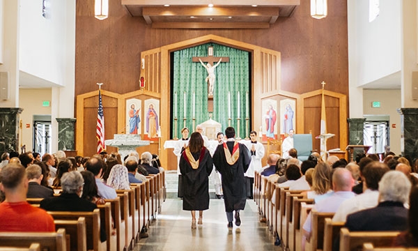 Two Students Walking to Altar